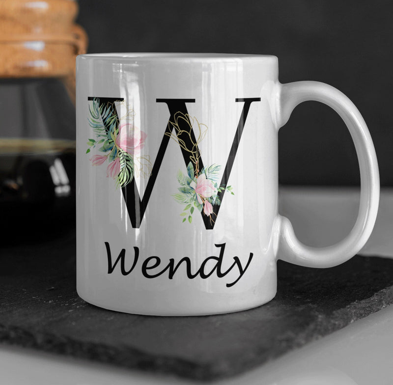 Personalised mug with custom initial and name of choice in a black flowery Letter. This customizable mug is the perfect gift idea for her. - little crafty souls